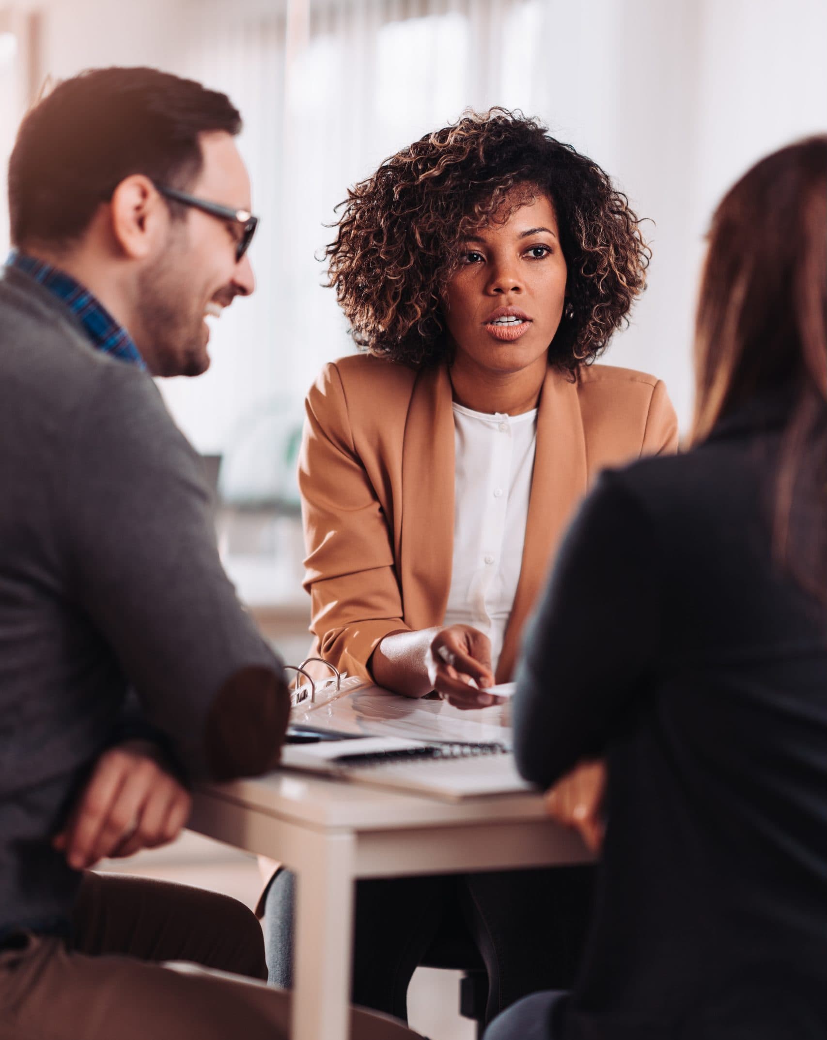 Multi ethnic group of business people discussing at the meeting​